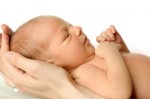 hands-holding-newborn-300x198